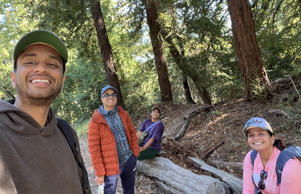 Shubham Kumar with family on a wooded trail