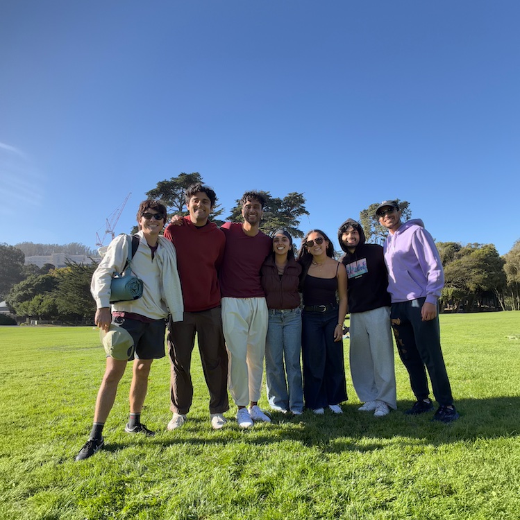 Shubham Kumar with friends on a grassy field